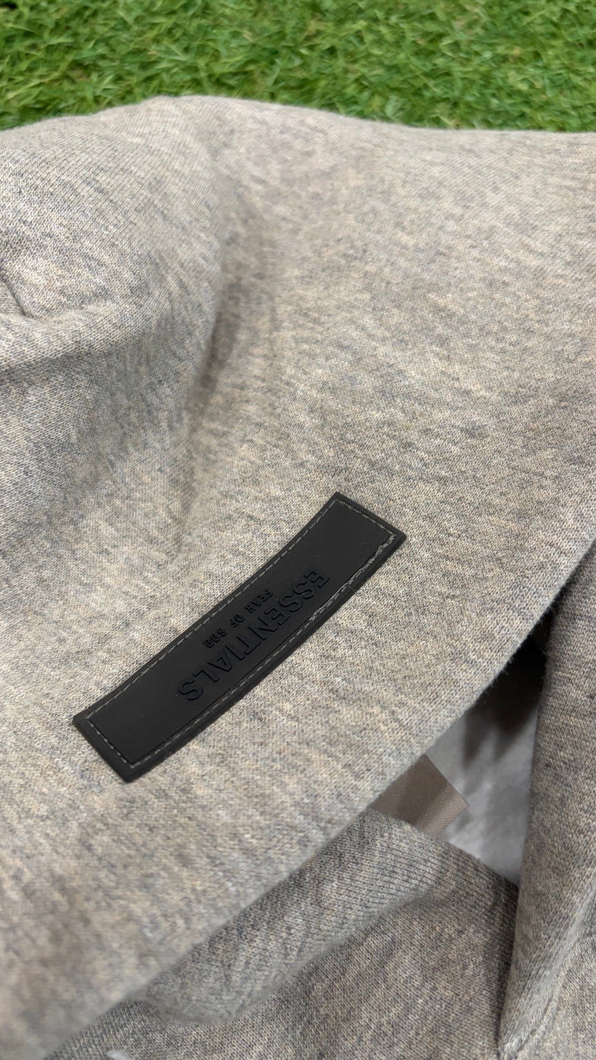 Dark Oatmeal Essentials hoodie hood label detail