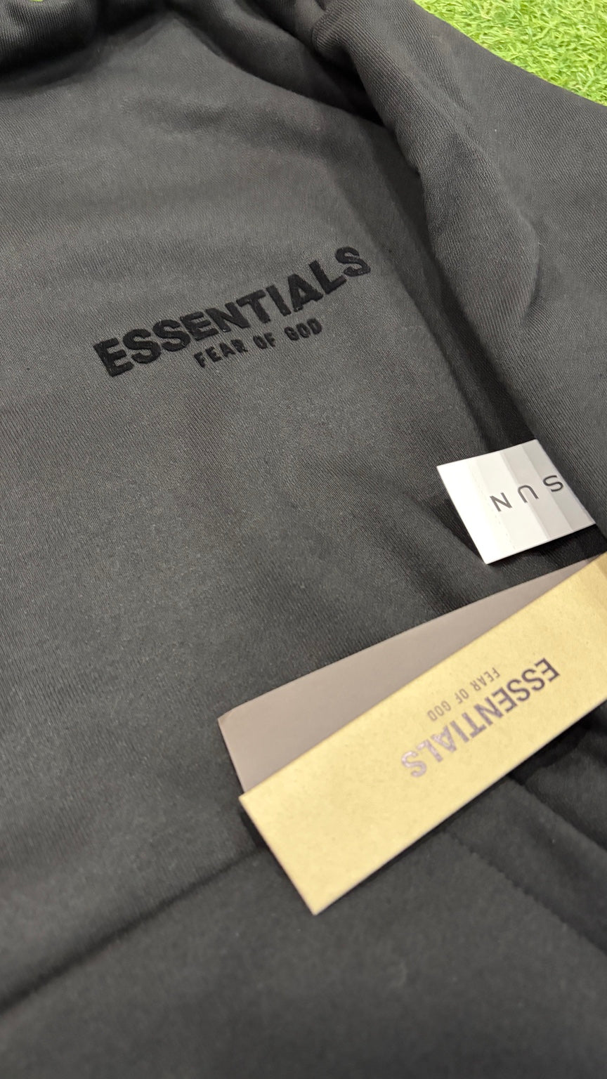 Black Essentials hoodie front logo detail
