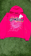 Hot pink sp5der hoodie front with dotted black logo and web graphic
