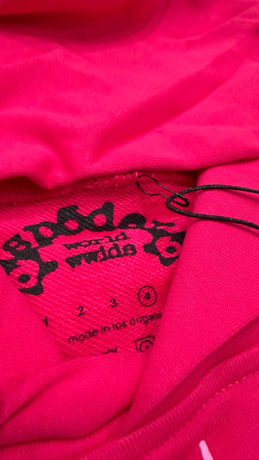 Inside printed brand label on hot pink hoodie
