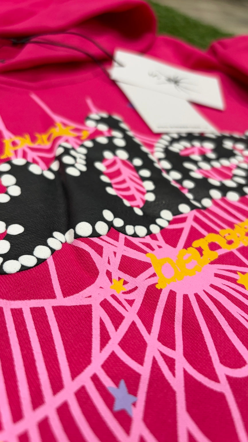 Detailed close-up dotted lettering and printed pink web