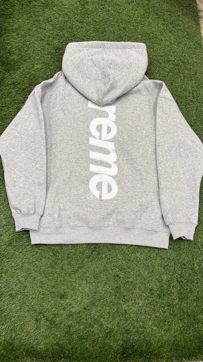Heather gray hoodie back with large vertical white logo