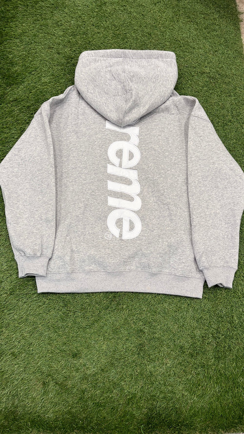 Heather gray hoodie back with large vertical white logo