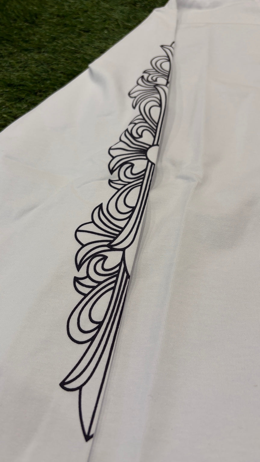 Detailed black ornamental graphic on sleeve