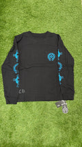 Front view of black long sleeve with blue horseshoe chest pocket and sleeve prints
