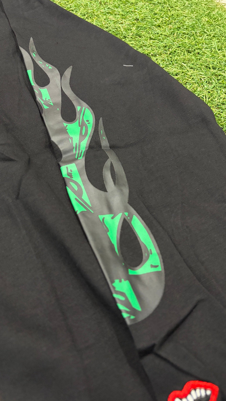 Green and charcoal flame design on sleeve